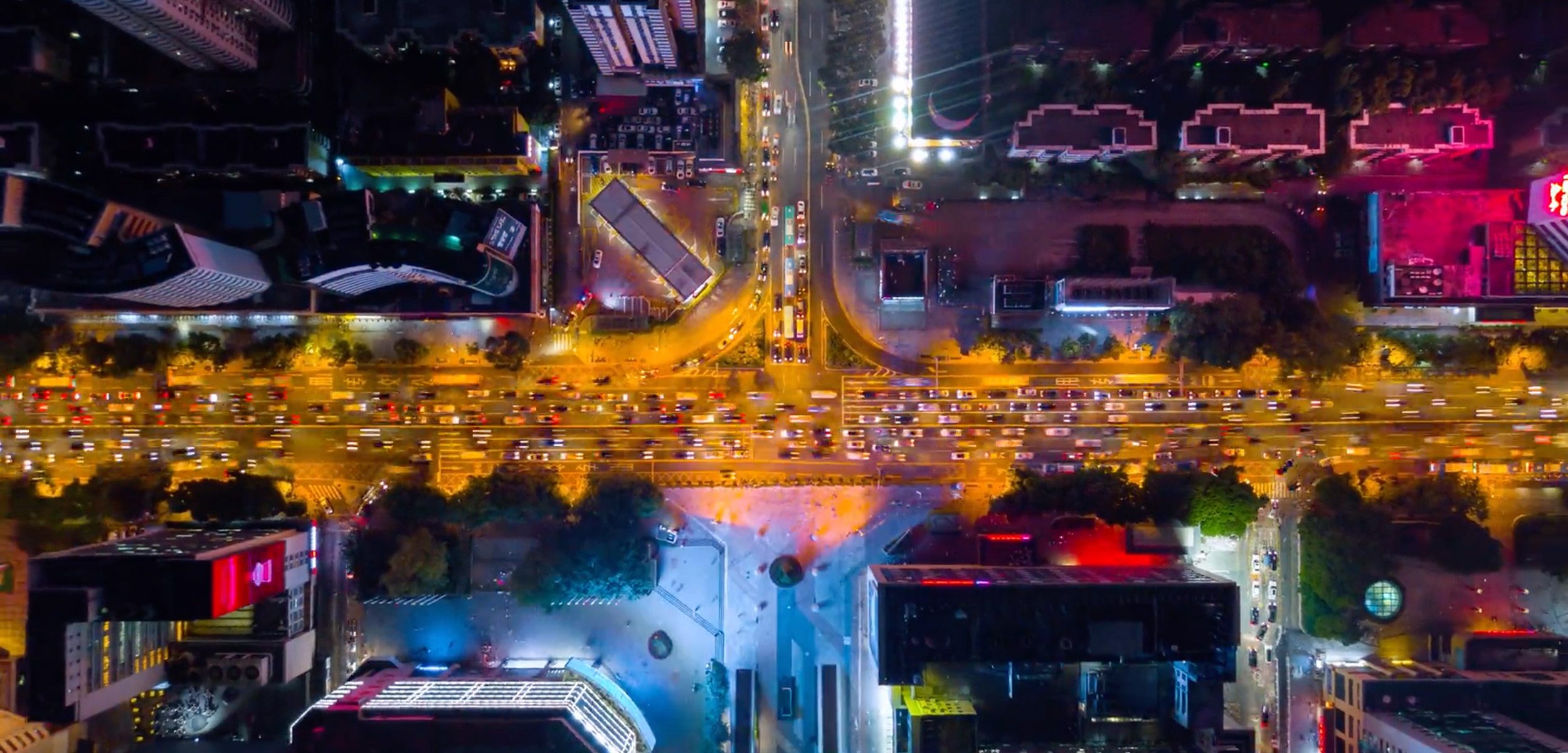 Street with cars driving at night